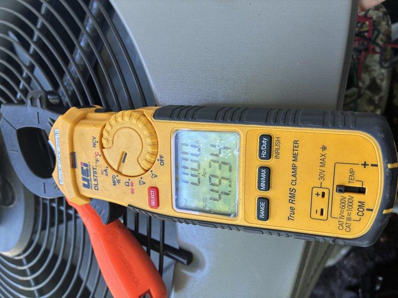 Completed routine cooling system maintenance and inspection on air conditioning unit. Performed electrical diagnostics using clamp meter, measuring amperage draw of 444.3 amps and verifying voltage readings at the outdoor condenser unit. Inspected condenser fan motor operation, checked capacitor condition, and tested all electrical connections for proper values. All components operating within normal parameters with no issues found.