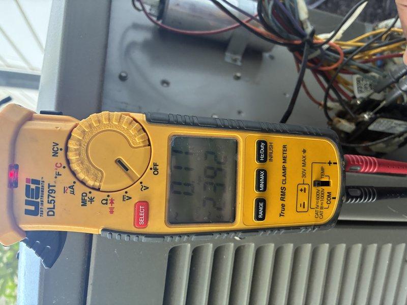 Completed routine cooling system maintenance and inspection on air conditioning unit. Performed electrical diagnostics using clamp meter, measuring amperage draw of 444.3 amps and verifying voltage readings at the outdoor condenser unit. Inspected condenser fan motor operation, checked capacitor condition, and tested all electrical connections for proper values. All components operating within normal parameters with no issues found.