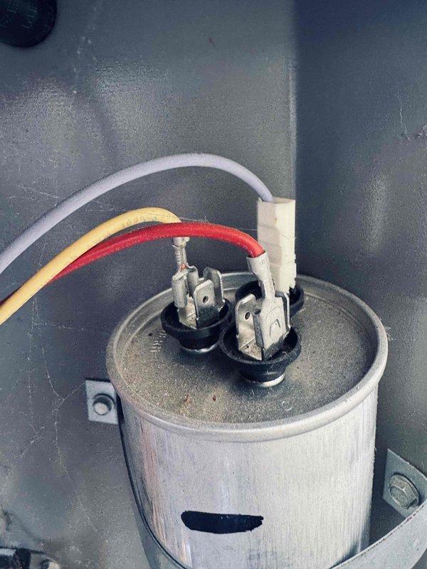 Performed routine MVP cooling maintenance visit on 6-year-old system. Coordinated access with tenant and landlord as instructed. Conducted diagnostic testing using digital multimeter to verify electrical readings and system performance. Inspected and tested capacitor component, checking terminal connections and wire integrity on white, yellow, and red leads. All electrical connections found secure with proper voltage readings. System operating within normal parameters upon completion of maintenance inspection.