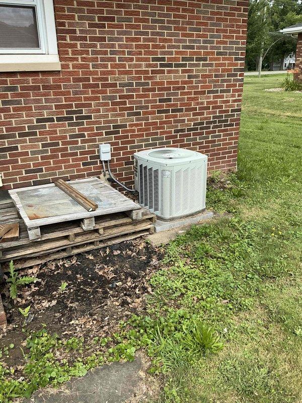 Responded to insurance claim for flooded furnace and air conditioning system due to backup water damage. Assessed exterior AC condenser unit and interior furnace/air handler in mechanical room, documenting extensive water damage to HVAC equipment for replacement estimate. Photographed all affected components including outdoor condensing unit, indoor furnace with exhaust venting, and surrounding mechanical infrastructure to support insurance documentation and system replacement requirements.