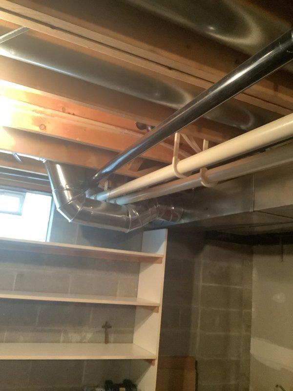 Conducted comprehensive on-site evaluation for furnace and air conditioning system replacement in residential property with unfinished basement installation area. Assessed existing HVAC infrastructure including ductwork configuration, supply and return air pathways, and mechanical space accessibility. Documented current system layout featuring flexible and rigid ductwork runs, evaluated structural clearances along exposed ceiling joists, and identified optimal equipment placement locations. Photographed existing installation conditions to support equipment sizing recommendations and replacement proposal development.