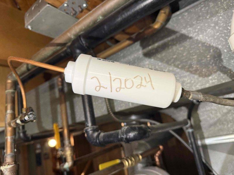Completed routine preventative maintenance on 11-year-old air conditioning system per recurring service agreement. Inspected electrical components including fuse block and time-delay fuses, verified proper operation and connections. Examined refrigeration system components including filter-drier dated 21024, copper refrigerant lines, and associated piping network for leaks, proper insulation, and system integrity. All components found operating within normal parameters and system cleared for continued service until next scheduled maintenance visit.