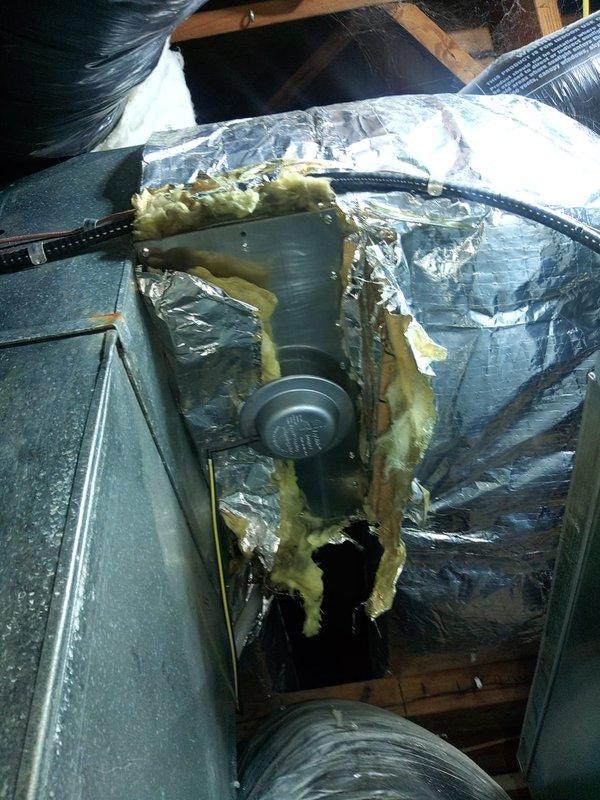 Completed installation of a two-trunk damper zone system for a Carrier HVAC unit. Installed zoning components including trunk dampers and associated ductwork in attic space, with system controls integrated to the existing furnace and air handler setup in the basement mechanical room.