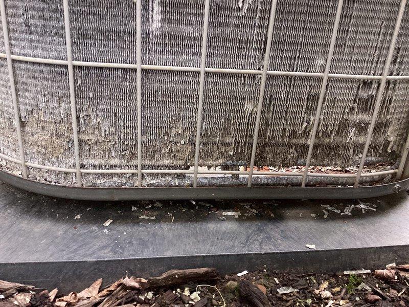 Completed annual cooling maintenance on one-year-old air conditioning system. Performed diagnostic testing with multimeter to verify electrical components and connections were functioning properly. Cleaned condenser coil which had accumulated significant dirt, dust, and debris buildup, and removed organic matter including leaves and twigs from base of outdoor unit to restore proper airflow and system efficiency.