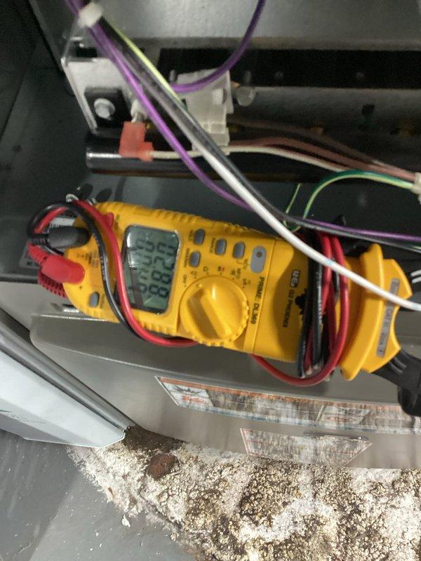 Completed annual cooling maintenance on one-year-old air conditioning system. Performed diagnostic testing with multimeter to verify electrical components and connections were functioning properly. Cleaned condenser coil which had accumulated significant dirt, dust, and debris buildup, and removed organic matter including leaves and twigs from base of outdoor unit to restore proper airflow and system efficiency.