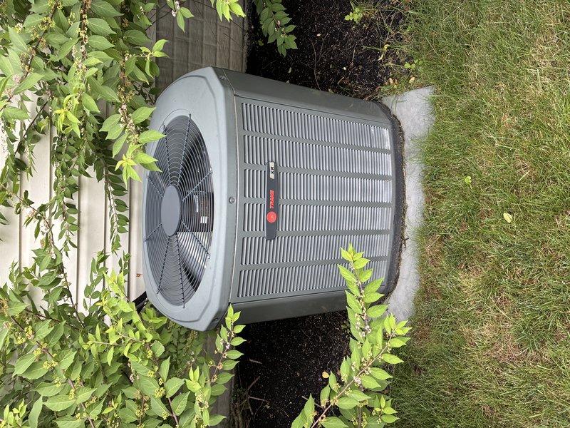 Completed preventive maintenance cooling visit on 10-year-old Trane air conditioning system. Performed standard inspection of outdoor condenser unit, verified fan operation and protective grille integrity, checked heat exchanger coils, and documented equipment condition with no issues identified. Unit operating within normal parameters.