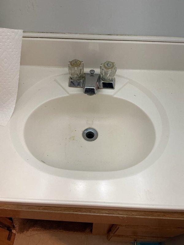 Conducted service call assessment and provided quotes for multiple plumbing issues. Inspected downstairs bathroom sink with leaking P-trap beneath basin and malfunctioning pop-up drain assembly that requires repair. Additionally identified clogged toilet requiring clearing service.