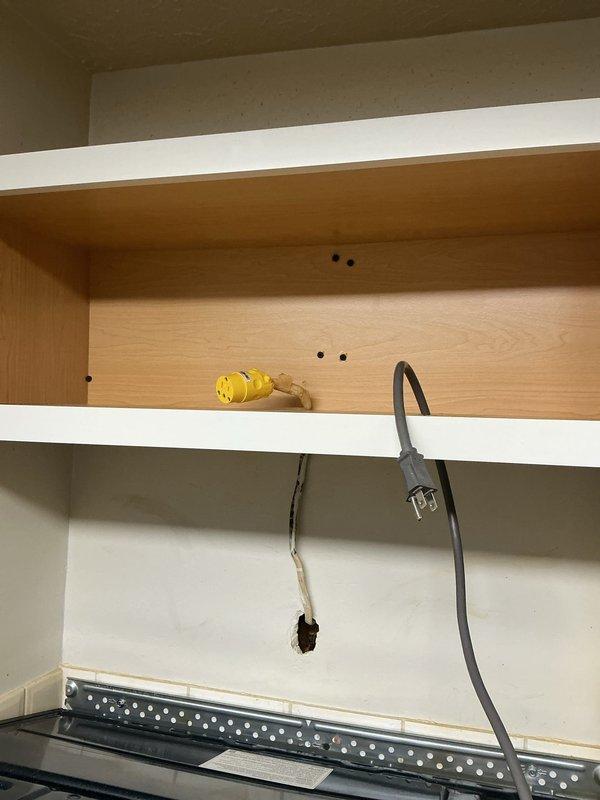 Responded to service call for non-compliant electrical outlets. Upon inspection, identified outdated outlets within cabinet space that did not meet current electrical code requirements. Replaced non-code-compliant outlets with new receptacles meeting NEC standards, ensuring proper grounding and secure mounting within the cabinet area where multiple appliance cords were connected.