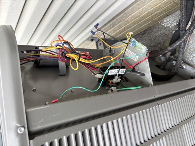 Completed MVP cooling maintenance visit on residential air conditioning system. Performed comprehensive inspection of outdoor condenser unit and internal electrical components, documenting equipment condition with photographs. Verified proper wiring connections at control relay, checked refrigerant line integrity, and confirmed unit operational status. System operating within normal parameters.