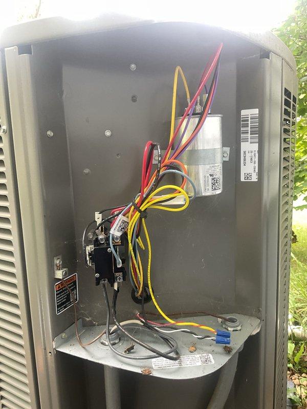 Completed comprehensive MVP maintenance tune-up on one-year-old commercial outdoor HVAC unit. Performed full system inspection including electrical connections, capacitor testing, contactor operation verification, and air filter evaluation. All components found operating within normal parameters; documented system condition with photos of internal electrical components and pleated air filter for maintenance records.