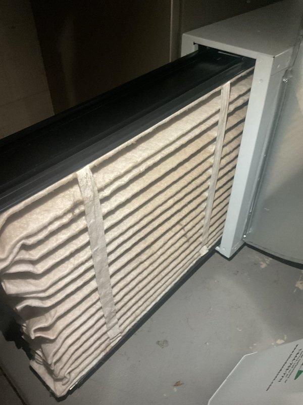 Completed comprehensive MVP maintenance tune-up on one-year-old commercial outdoor HVAC unit. Performed full system inspection including electrical connections, capacitor testing, contactor operation verification, and air filter evaluation. All components found operating within normal parameters; documented system condition with photos of internal electrical components and pleated air filter for maintenance records.
