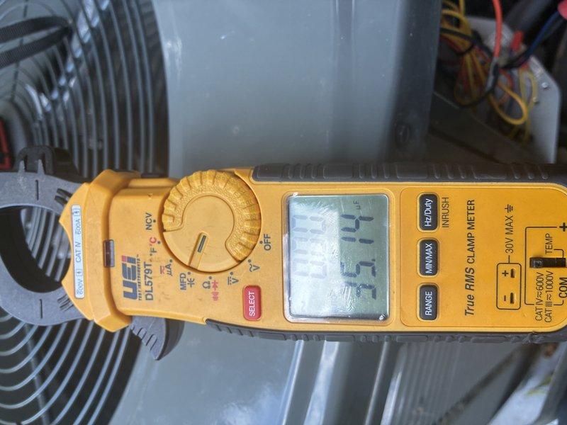 Completed preventive maintenance cooling visit on HVAC system. Performed electrical diagnostics using clamp meter, recording amperage reading of 37.7 amps on system components. Inspected and evaluated air filter condition, which showed standard accumulation consistent with normal operation.