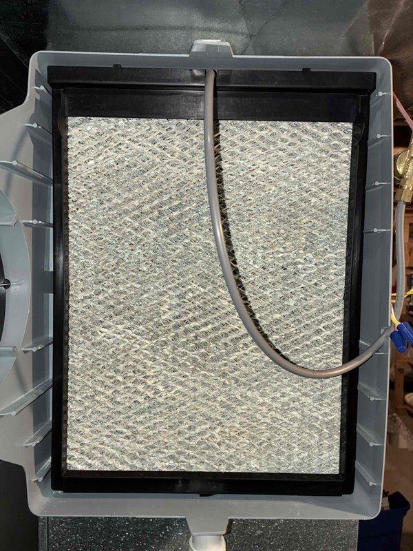 Completed preventive maintenance cooling visit on HVAC system. Performed electrical diagnostics using clamp meter, recording amperage reading of 37.7 amps on system components. Inspected and evaluated air filter condition, which showed standard accumulation consistent with normal operation.