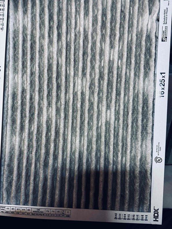 Completed air conditioning tune-up on 2-year-old system. Inspected electrical connections at contactor and terminal block, verified all wiring secure with no signs of overheating or loose terminals. Inspected 16x25x1 air filter showing moderate dirt accumulation and documented condition; filter remains serviceable but should be monitored for replacement at next service interval.