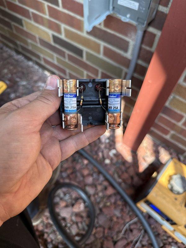 Completed full HVAC system installation including new air handler, air conditioning condenser unit, and complete ductwork replacement over two-day period. Installed new disconnect assembly with 25-amp Bussman fuses at outdoor unit location, performed system evacuation and verified proper vacuum levels reaching 203 microns using calibrated digital gauge to ensure system integrity before refrigerant charging. All components tested and operational upon completion.