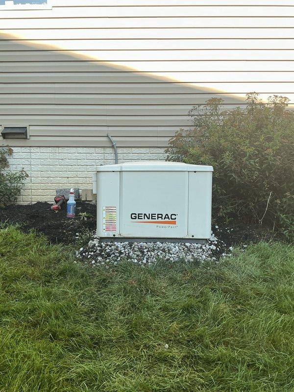 Releveled Generac PowerPact backup generator unit that had settled unevenly on its concrete pad. Transported decorative gravel from shop to site and installed gravel base beneath and around generator to ensure proper leveling and drainage. Verified unit was stable and level after adjustment to prevent operational issues and maintain manufacturer specifications.