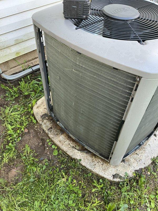 Performed system diagnostics on residential Lennox split system and found temperature split slightly below optimal range. Upon inspection, condenser coil showed significant accumulation of dirt and debris restricting airflow through fins. Recommended chemical coil cleaning to restore efficiency, prevent premature component failure, and reduce stress on system. Customer approved repair and scheduled follow-up appointment for chemical wash service.