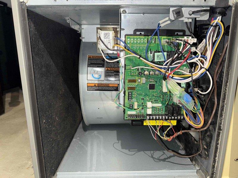 Completed MVP recurring cooling maintenance visit on 11-year-old HVAC system. Performed comprehensive inspection of electrical control cabinet, verifying proper operation of circuit boards, control relays, and wiring connections. All safety labels and warnings confirmed present and legible on equipment panels and cabinet doors. Inspected exterior unit casing, noting normal operational wear and dust accumulation consistent with system age. Documented system condition with photos of control components and exterior unit for maintenance records.