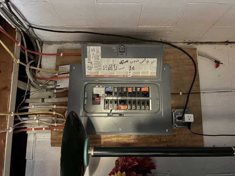 Performed site assessment and provided estimate for ground rod replacement and reconnection to main electrical panel. Ground rod was accidentally pulled out during excavation work, compromising the electrical system's grounding protection. Documented existing electrical panel configuration showing multiple circuit breakers and current grounding wire connections. Evaluated exterior conditions where ground rod was displaced near building foundation in landscaped area. Quoted necessary materials and labor to install new ground rod, establish proper bonding connection to service panel, and restore electrical grounding system to code compliance.