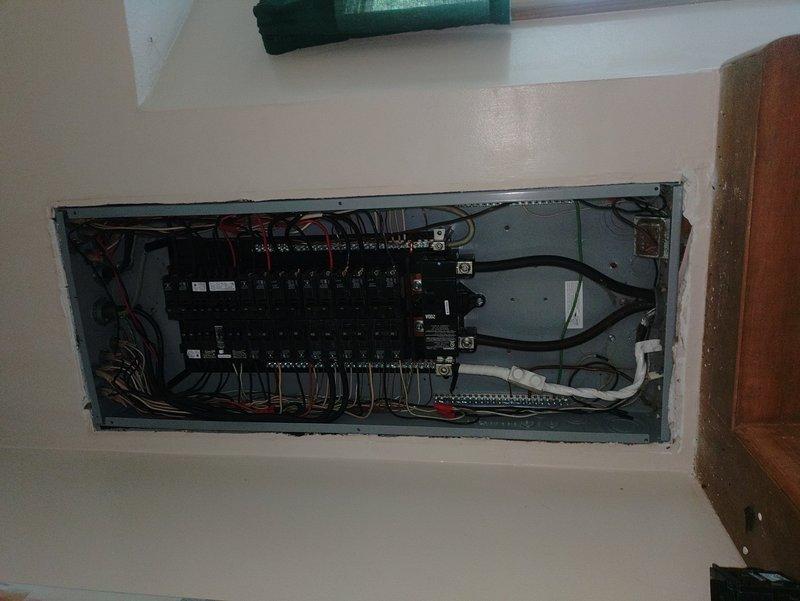 Corrected an undersized electrical circuit serving the air handler that was improperly tied into the heat pump circuit. Removed the existing 30-amp circuit from the attic unit to dedicate it solely to the outdoor heat pump unit, then upsized the breaker to the appropriate amperage rating. Installed a new 60-amp circuit by running electrical conduit and wiring up the exterior of the home, through the attic space, and terminated connections at circuit #1 on the air handler control panel. Verified all wire gauges met code requirements for the upgraded amperage, organized and secured all connections within the electrical distribution panel, and confirmed proper operation of both HVAC units on their dedicated circuits.