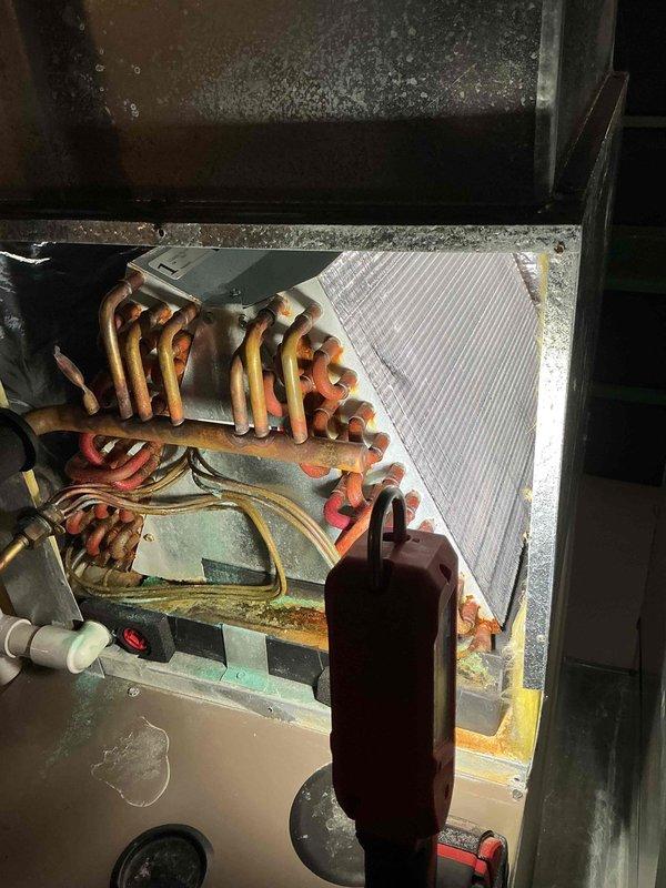 Completed scheduled MVP cooling maintenance on 6-year-old air conditioning system. Performed comprehensive inspection of electrical components, capacitor, and wiring connections within control panel. Examined evaporator coil assembly and copper refrigerant lines, noting oxidation and patina development consistent with unit age. Assessed finned heat exchanger section and documented dust accumulation on coil surfaces. Verified system operational status and added refrigerant charge as indicated by blue dye testing procedure. All electrical connections secure and system functioning within normal parameters.