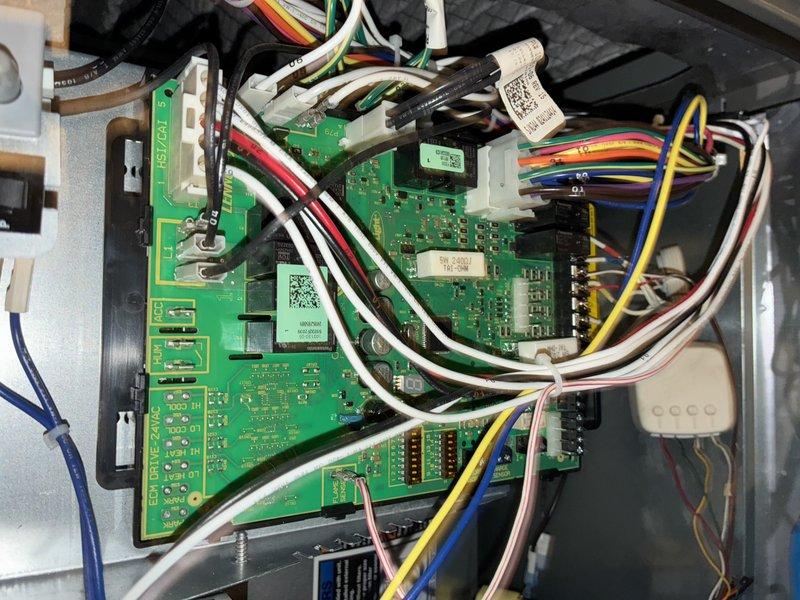 Completed preventive maintenance on a 2-year-old MVP air conditioning system. Inspected control board electronics, verified all wire connections and harnesses were secure, and examined the pleated air filter element which showed normal condition for the system's age.