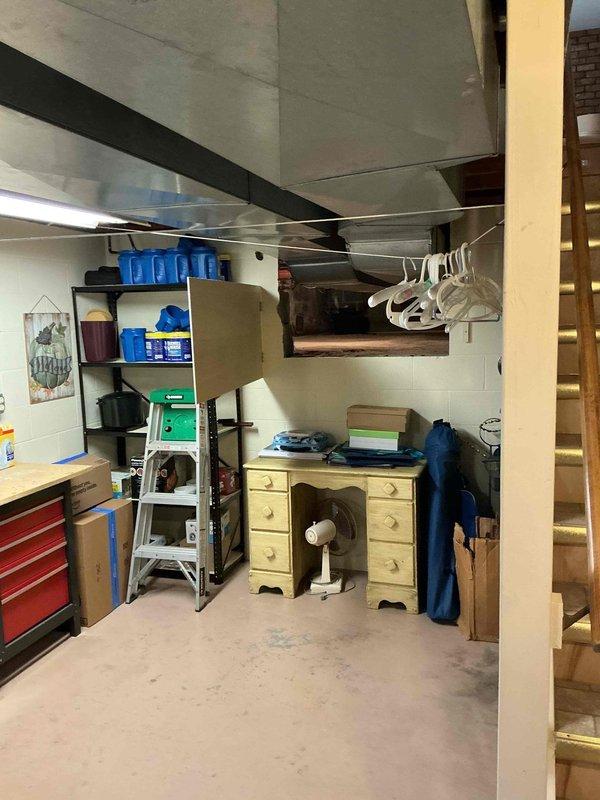 Conducted comprehensive site assessment for whole home generator installation. Evaluated electrical service panel location in basement stairwell area and assessed available clearances for equipment placement. Documented existing electrical infrastructure, including main service panel positioning and available routing paths for generator feed circuits. Surveyed basement utility space to determine optimal generator transfer switch location and conduit run requirements. Photographed current electrical configuration, ductwork placement, and structural elements to develop accurate material list and labor estimate for automatic standby generator system installation.