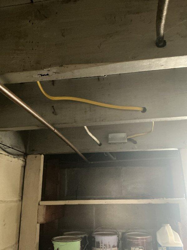 Addressed multiple electrical code violations identified during city inspection. Corrected improper wire splice in basement area, removed unsafe hanging receptacle, and installed GFCI protection on exterior bell box for enhanced safety and code compliance. Added wireless three-way switch system to control pull-chain light fixture serving attic access stairway, improving functionality and convenience. All work completed to meet current electrical code requirements and pass final inspection.