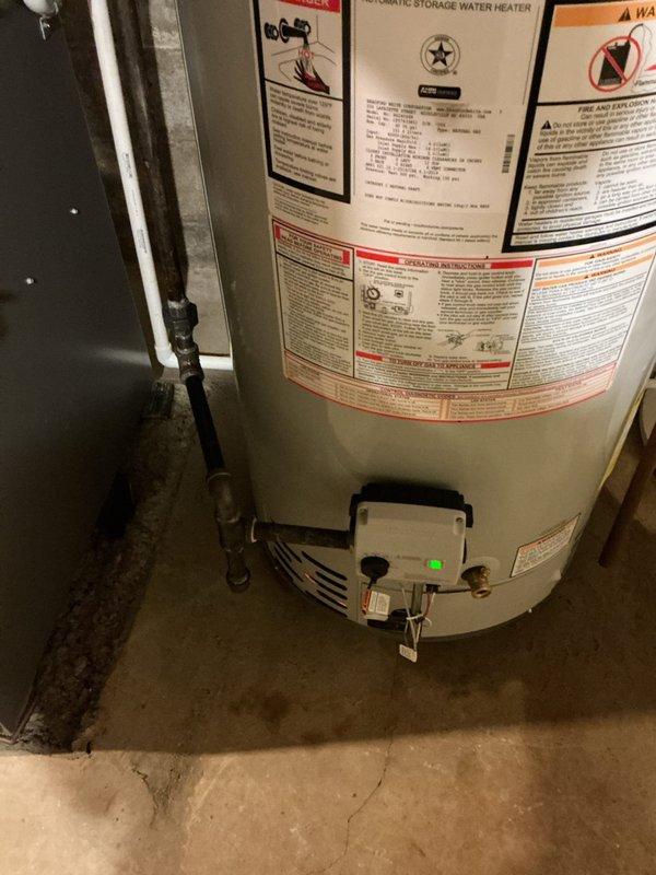 Replaced a leaking Rheem 40-gallon short water heater with a new Bradford White 40-gallon short unit featuring a 6-year manufacturer warranty. Installation included proper bonding wire, thermal expansion tank, and hard-piped gas line to eliminate the existing flexible gas connector. All components staged and installed to code specifications with appropriate safety measures and operational testing completed.