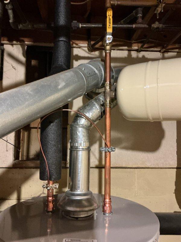 Replaced a leaking Rheem 40-gallon short water heater with a new Bradford White 40-gallon short unit featuring a 6-year manufacturer warranty. Installation included proper bonding wire, thermal expansion tank, and hard-piped gas line to eliminate the existing flexible gas connector. All components staged and installed to code specifications with appropriate safety measures and operational testing completed.