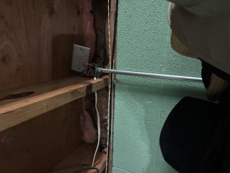 Responded to no cooling complaint on 7-year-old system. Inspected condensate drain pump assembly mounted in basement mechanical space and found unit not operating properly, preventing normal system operation. Tested electrical connections, verified proper wiring configuration with wire nuts securing line voltage connections, and confirmed pump motor functionality. System restored to normal cooling operation with condensate removal working as designed.