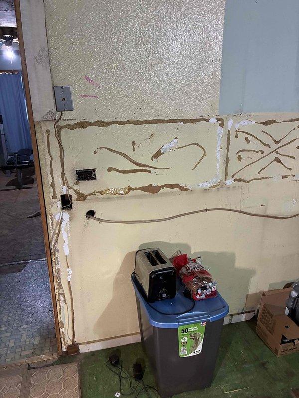 Conducted comprehensive electrical assessment for whole-house wiring upgrade and main service panel replacement. Evaluated existing electrical infrastructure throughout property, which is currently undergoing extensive renovation with exposed insulation, deteriorated wall surfaces, and visible plumbing modifications. Documented current electrical outlet locations, assessed adequacy of existing branch circuits, and identified scope of work required to bring electrical system up to current code standards for panel upgrade and complete rewiring project.