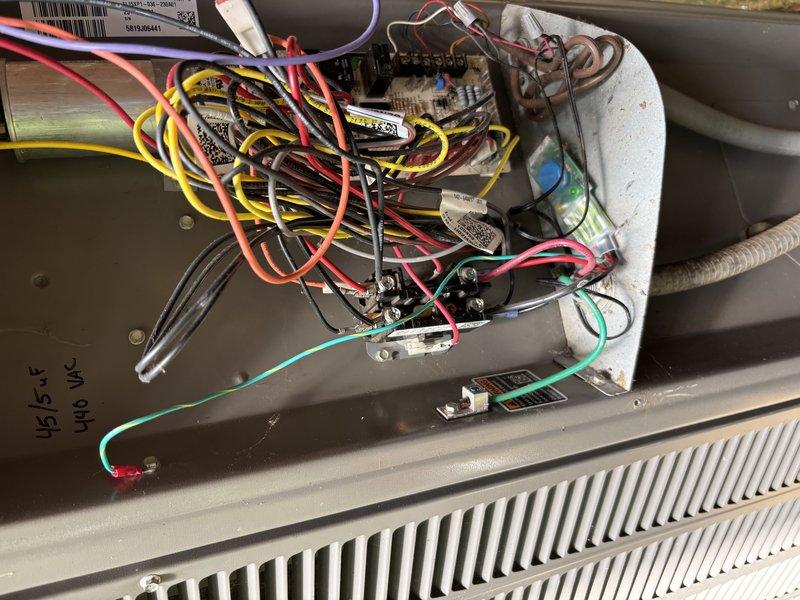 Completed MVP cooling maintenance visit on 6-year-old heat pump system that was rescheduled from previous date. Performed comprehensive inspection of electrical connections, control board, and wiring compartment, verifying all wire terminations and relay assemblies were secure and functioning properly. Documented system condition with photos showing internal components, heat sink assembly, and wire routing configuration for service records.