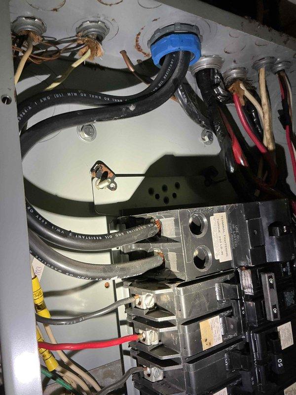 Conducted on-site electrical assessment for Generac and Kohler generator installation estimate. Inspected existing electrical service panel to evaluate capacity and compatibility for generator integration, documenting current breaker configuration, wire sizing, and available knockout entry points for transfer switch connections. Photographed electrical panel interior showing circuit breaker arrangement, bus bar assembly, incoming service conductors, and branch circuit wiring to determine appropriate generator sizing and transfer switch specifications for seamless backup power integration.