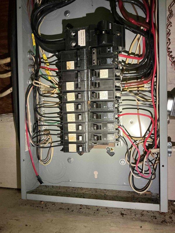 Conducted on-site electrical assessment for Generac and Kohler generator installation estimate. Inspected existing electrical service panel to evaluate capacity and compatibility for generator integration, documenting current breaker configuration, wire sizing, and available knockout entry points for transfer switch connections. Photographed electrical panel interior showing circuit breaker arrangement, bus bar assembly, incoming service conductors, and branch circuit wiring to determine appropriate generator sizing and transfer switch specifications for seamless backup power integration.