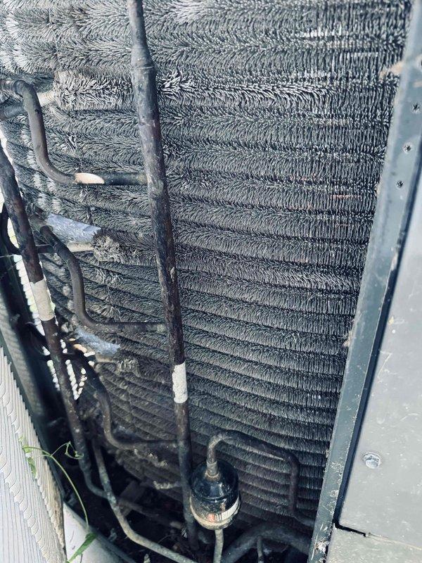 Completed scheduled MVP cooling maintenance visit on 13-year-old HVAC system. Performed comprehensive inspection of evaporator coil assembly, noting normal dust accumulation on aluminum fins consistent with system age and operational history. Examined refrigerant lines for integrity, observing typical surface oxidation and wear patterns on copper piping with existing insulation wrapping intact. Inspected control board and electrical connections within system panel, verifying all relay components, terminal blocks, and multi-colored wiring harnesses were properly secured and functioning. Documented condition of blower motor assembly and associated sensor components. System operating within normal parameters for unit age with no immediate repairs required at this time.