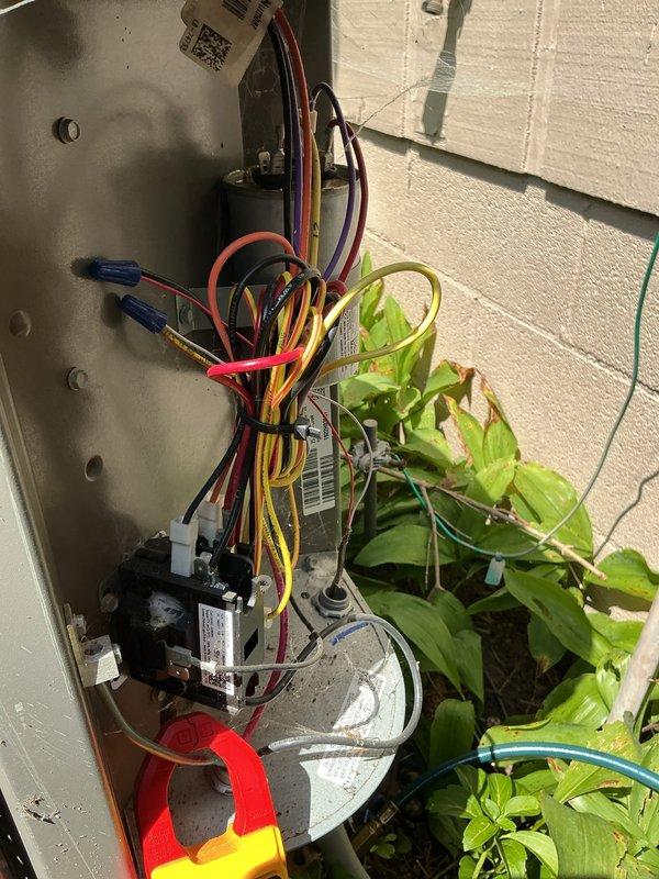 Responded to no-cooling call for property unoccupied for two years. Performed diagnostic testing on two outdoor condensing units. Removed top panels and inspected internal components including compressor, fan motors, and electrical systems. Used multimeter to test voltage and amperage at contactors, capacitors, and compressor terminals. Checked refrigerant pressures with manifold gauges. Inspected wiring connections, relays, and control boards for signs of corrosion or damage from extended non-use. Verified fan motor operation and capacitor values on both units.