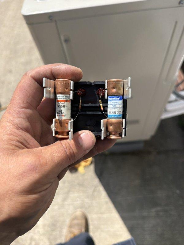 Completed installation of a 2-head ductless mini-split system in an attic space. Mounted indoor air handler unit on plywood wall, installed electrical disconnect with fused protection, and routed refrigerant lines and condensate drainage per manufacturer specifications.