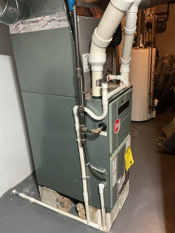Completed comprehensive AC tune-up on residential split system with outdoor condensing unit and indoor furnace. Performed full system inspection, verified refrigerant levels, cleaned condenser coils, checked electrical connections, tested thermostat operation, and confirmed proper airflow throughout the system. All components found operating within manufacturer specifications with no immediate repairs needed.