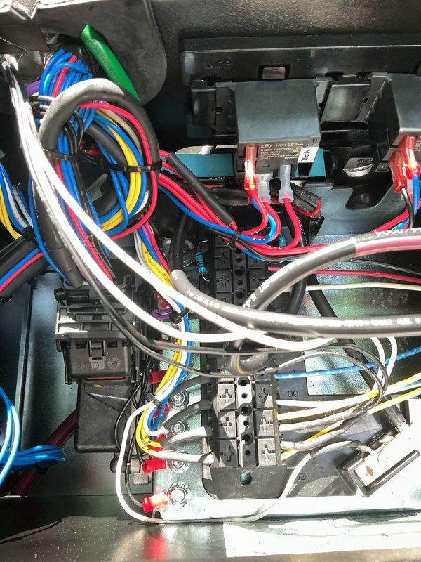 Responded to service call for newly installed Generac generator that was failing to start. Upon inspection, identified multiple electrical issues stemming from improper installation: GFCI devices were tripping breakers throughout the residence, and the whole house surge protector was not functioning correctly. Accessed generator control panel and internal wiring compartment to diagnose electrical faults. Inspected color-coded wiring connections, terminal blocks, and control board components within the generator housing. Verified proper wire routing and connections to battery, control circuits, and power distribution terminals. Corrected wiring deficiencies and tested system operation to ensure generator startup functionality and proper integration with home electrical system. Resolved GFCI tripping issues and verified surge protection system was operating within specifications.
