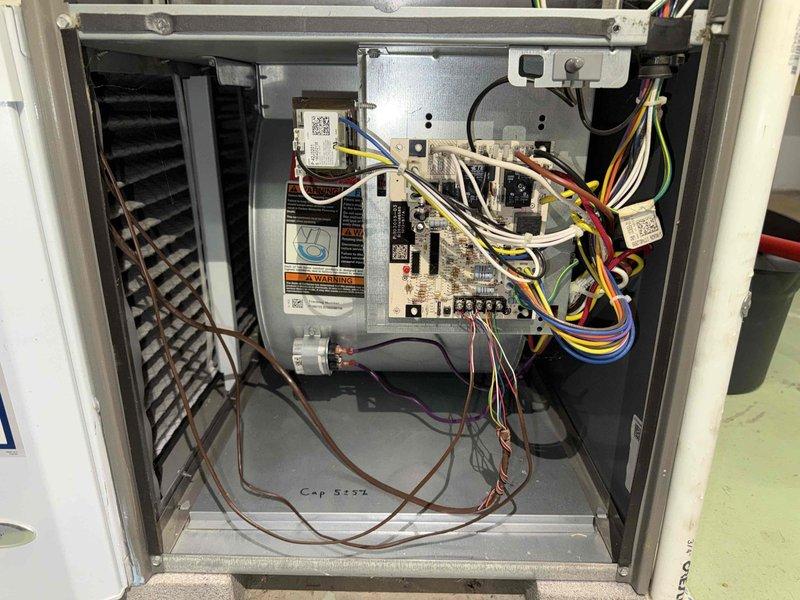 Completed preventive maintenance visit on 7-year-old air conditioning system for MVP customer. Performed comprehensive system inspection including control board evaluation, electrical connections assessment, and internal component examination. Documented system condition with detailed photography of contactor assembly showing normal wear patterns and control cabinet wiring configuration. All components functioning within normal parameters at time of service.