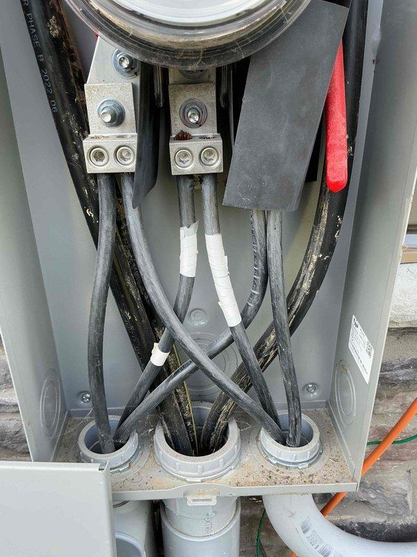 Conducted comprehensive site assessment for whole home generator installation. Documented existing electrical service entrance configuration, including current meter base assembly, service entrance conductors, and main panel connections. Photographed meter panel installation showing digital meter housing, terminal blocks, and 600V rated service cables with proper securing and connection points. Evaluated interior panel components including bus bars, terminal connections, and cable entry points to determine compatibility and capacity requirements for generator integration. Assessment included verification of service entrance conductor sizing, available connection points, and necessary modifications for automatic transfer switch installation.