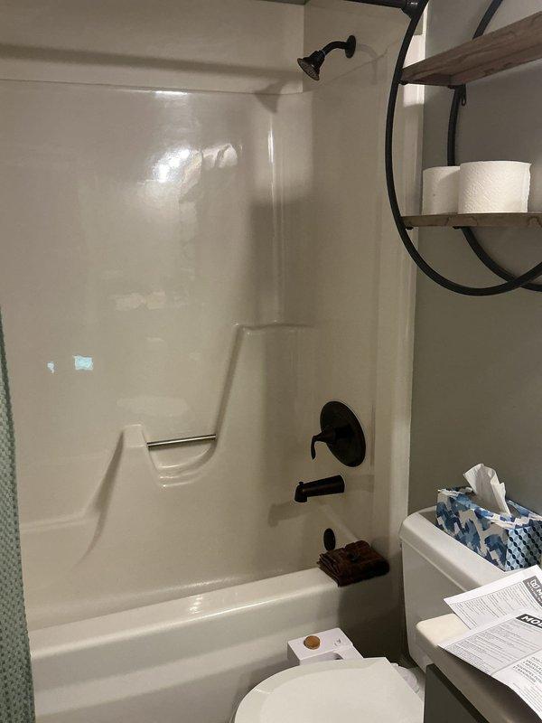 Replaced upstairs bathtub shower valve assembly including installation of new rough-in valve with integral stops and repair plate. Installed oil-rubbed bronze Moen Eva trim package to match existing bathroom fixtures. All components ordered with appropriate lead time and installation completed upon parts arrival, resulting in fully functional tub-shower control system with updated aesthetic finish.