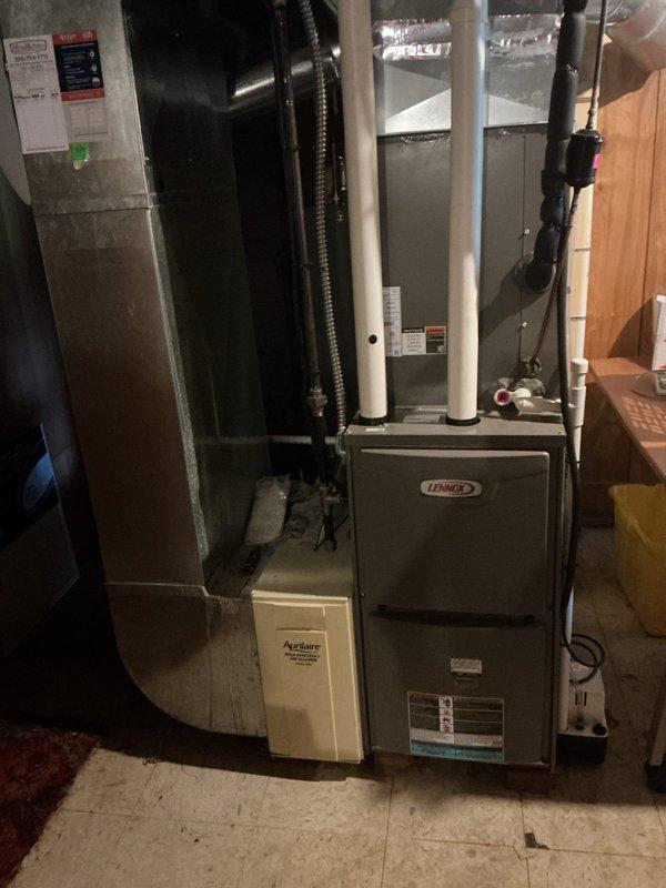 Completed annual preventative maintenance on two-year-old Lennox cooling system. Performed comprehensive inspection of indoor evaporator coil unit and outdoor condensing unit, including electrical connections, capacitor operation, and refrigerant circuit components. Verified all wiring connections secure, tested capacitor functionality, and confirmed system operating within manufacturer specifications with no deficiencies noted.