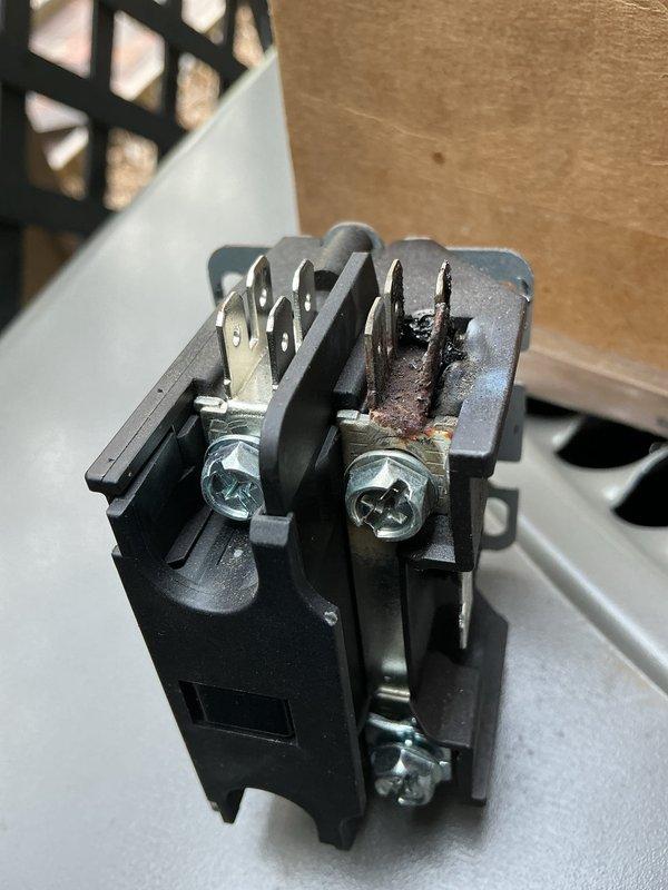 Responded to no-cooling call and diagnosed loose wire connections at contactor causing overheating, wire failure, and blown fuse. Repaired damaged wiring, secured all electrical connections, and replaced failed fuse to restore cooling operation. System tested and confirmed operating normally. Contactor shows burn damage and scorching from electrical fault and has been ordered for replacement during follow-up visit.