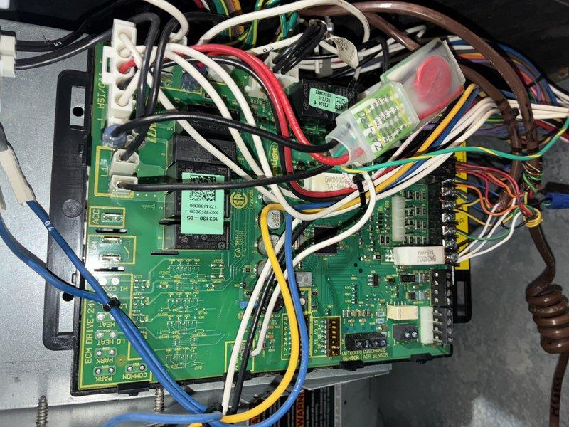 # HVAC Maintenance - Cooling Service Completed

Performed scheduled MVP cooling maintenance visit on residential HVAC system. Conducted comprehensive inspection of control board assembly, verifying proper operation of all electronic components, circuit connections, and terminal blocks. All wiring connections, including power and control circuits, were found secure with no signs of overheating or deterioration. Circuit boards showed normal operation with all indicator lights functioning correctly.

Inspected associated mechanical equipment in utility area, noting water heater condition with visible corrosion and rust staining on tank surface. Verified all copper piping connections and fittings remained secure. System tested and confirmed operational within normal parameters upon completion of maintenance visit.