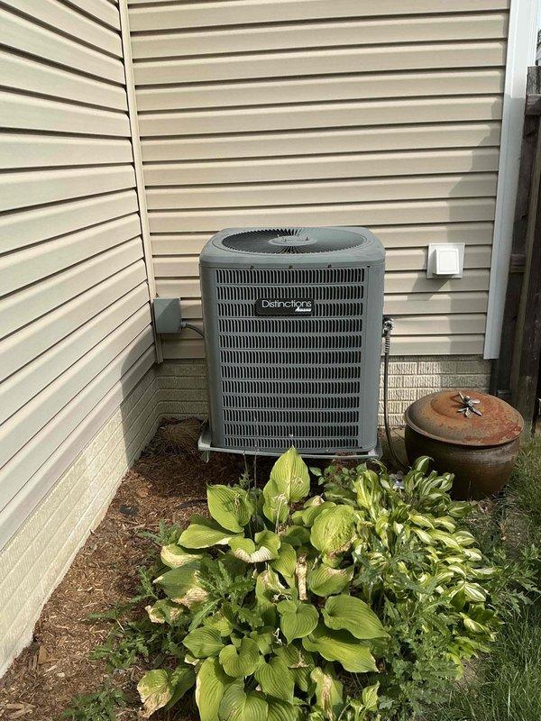 Conducted on-site evaluation for complete HVAC system replacement at residential property. Assessed existing outdoor condensing unit with horizontal fin grille pattern and indoor air handler/furnace system located in basement utility area. Documented current equipment configuration, including ductwork connections and system placement relative to existing plumbing infrastructure and storage areas. Provided comprehensive replacement estimate for new HVAC system installation.