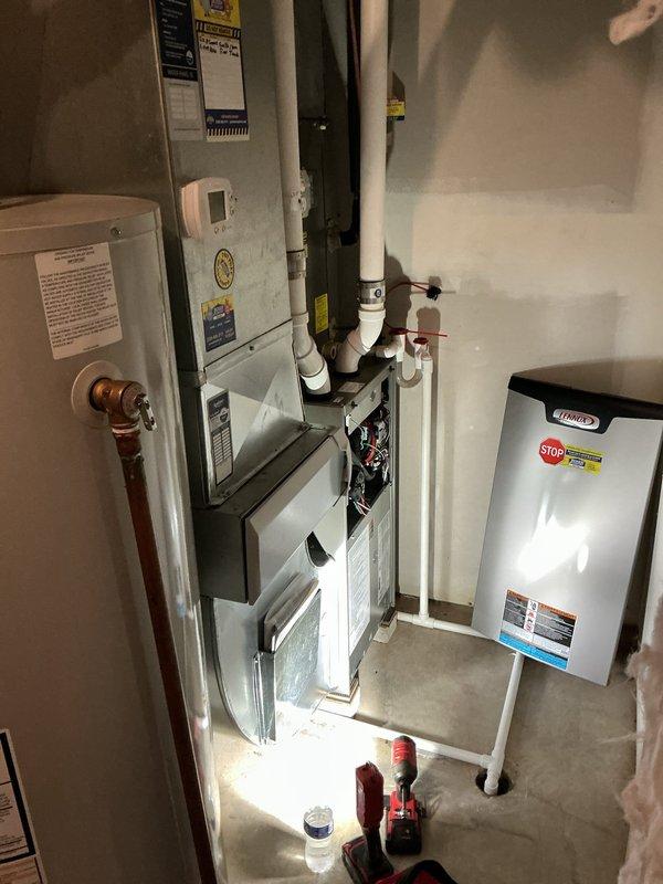Completed preventative maintenance on residential air conditioning system for new homeowner. Inspected indoor furnace unit and outdoor condenser, which showed signs of weathering and accumulated debris on exterior panels. Noted outdoor unit surrounded by overgrown vegetation requiring clearance for proper airflow. Evaluated ductwork accessibility for potential future cleaning services. System age undetermined at time of service. Recommended customer contact office to transfer existing maintenance plan coverage from previous address to current property.