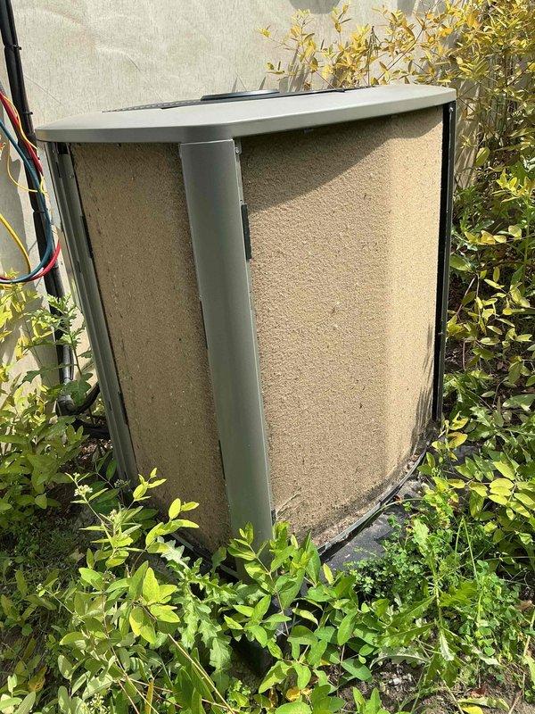 Completed preventative maintenance on residential air conditioning system for new homeowner. Inspected indoor furnace unit and outdoor condenser, which showed signs of weathering and accumulated debris on exterior panels. Noted outdoor unit surrounded by overgrown vegetation requiring clearance for proper airflow. Evaluated ductwork accessibility for potential future cleaning services. System age undetermined at time of service. Recommended customer contact office to transfer existing maintenance plan coverage from previous address to current property.