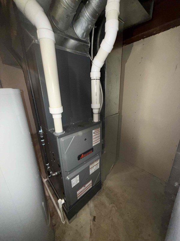 Completed MVP recurring cooling maintenance visit on residential HVAC system. Performed comprehensive inspection of Amana furnace unit and associated components including air distribution system, curved louver diffuser assembly, PVC intake/exhaust piping, and flexible ductwork connections. All system components found to be in good operating condition with no visible signs of deterioration, damage, or required repairs. Documentation photos captured for service records.